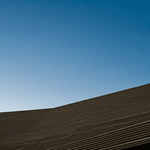 Modern architectural lines against a clear twilight sky